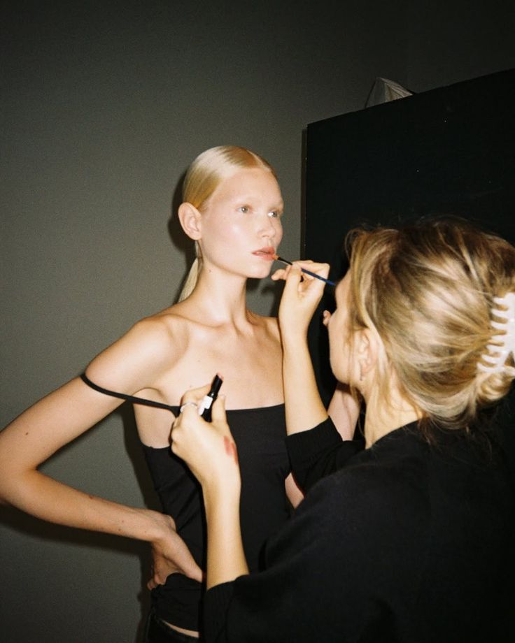model and makeup artist backstage
