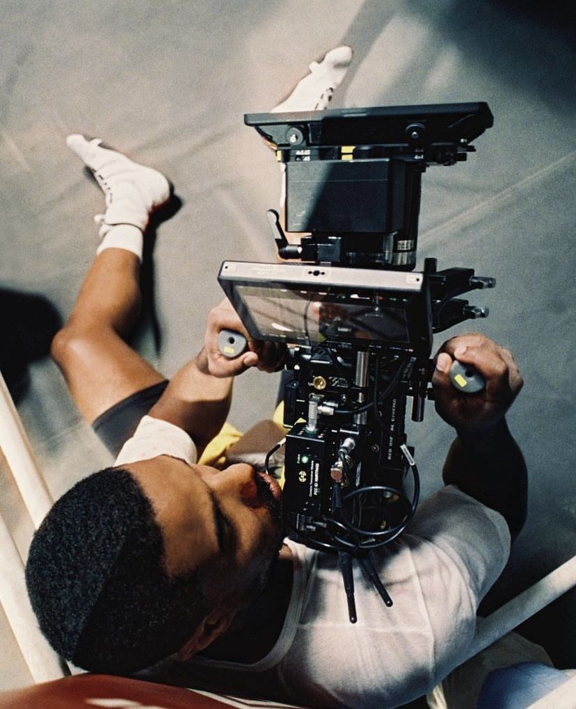 videographer operating a cinema camera on a rig